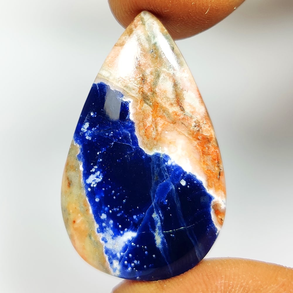 25.04 Ct Natural Blue Sodalite Pear Cab: Weight - 25.04 Ct / Size - 35.00 x 20.40 x 5.50 mm / Shape - Pear Cab / Clarity - Opaque / Origin - Russia / Treatment - None