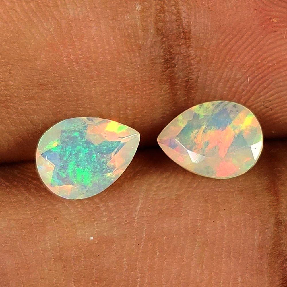 1.42 Ct Natural Multicolor Welo Fire Opal Pear Cut Pair: Weight - 1.42 Ct / Dimensions - 8.00 x 6.00 x 4.00 mm / 2 Pc's / Shape - Pear Cut / Color - Multicolor / Transparency - Translucent / Origin - Ethiopia / Treatment - None