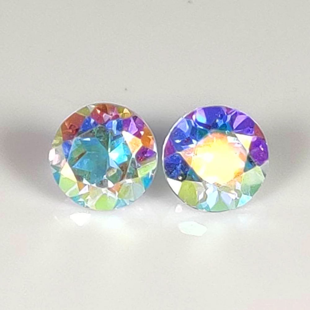 2.06 Ct Natural Color Coated Topaz Round Cut Pair: Weight - 2.06 Ct / Dimensions - 6.00 x 6.00 x 4.00 mm / 2 Pc's / Shape - Round Cut / Color - Bicolor / Clarity - VVS / Origin - Brazil / Treatment - Color Coated