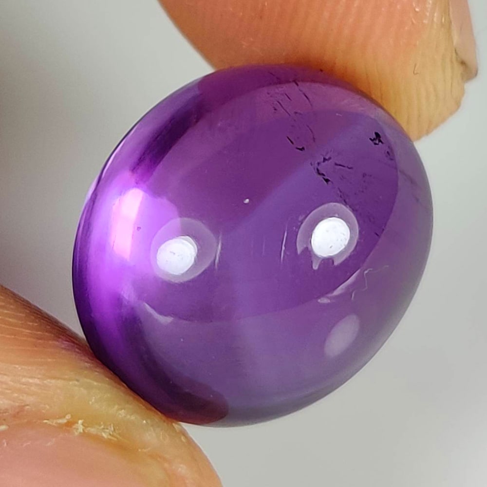 18.80 Ct Natural Purple Amethyst Oval Cab: Weight - 18.80 Ct / Size - 15.90 x 13.90 x 12.00 mm / Shape - Oval Cab / Color - Purple / Clarity - VVS / Origin -Brazil / Treatment - Heated
