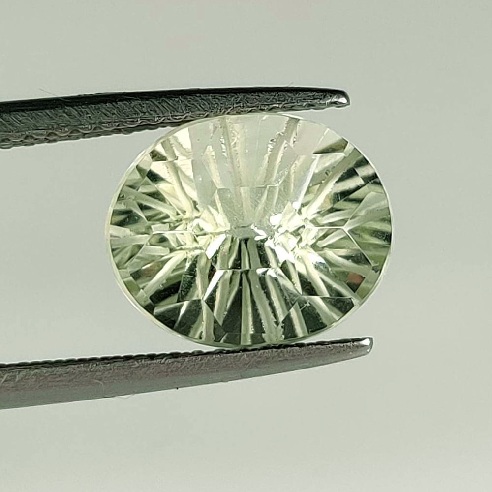 3.84 Ct Natural Green Amethyst Oval Football Cut: Weight - 3.84 Ct / Dimensions - 11.00 x 9.00 x 7.60 mm / Shape - Oval Football Cut / Color - Green / Clarity - VVS / Origin - Brazil / Treatment - Heated