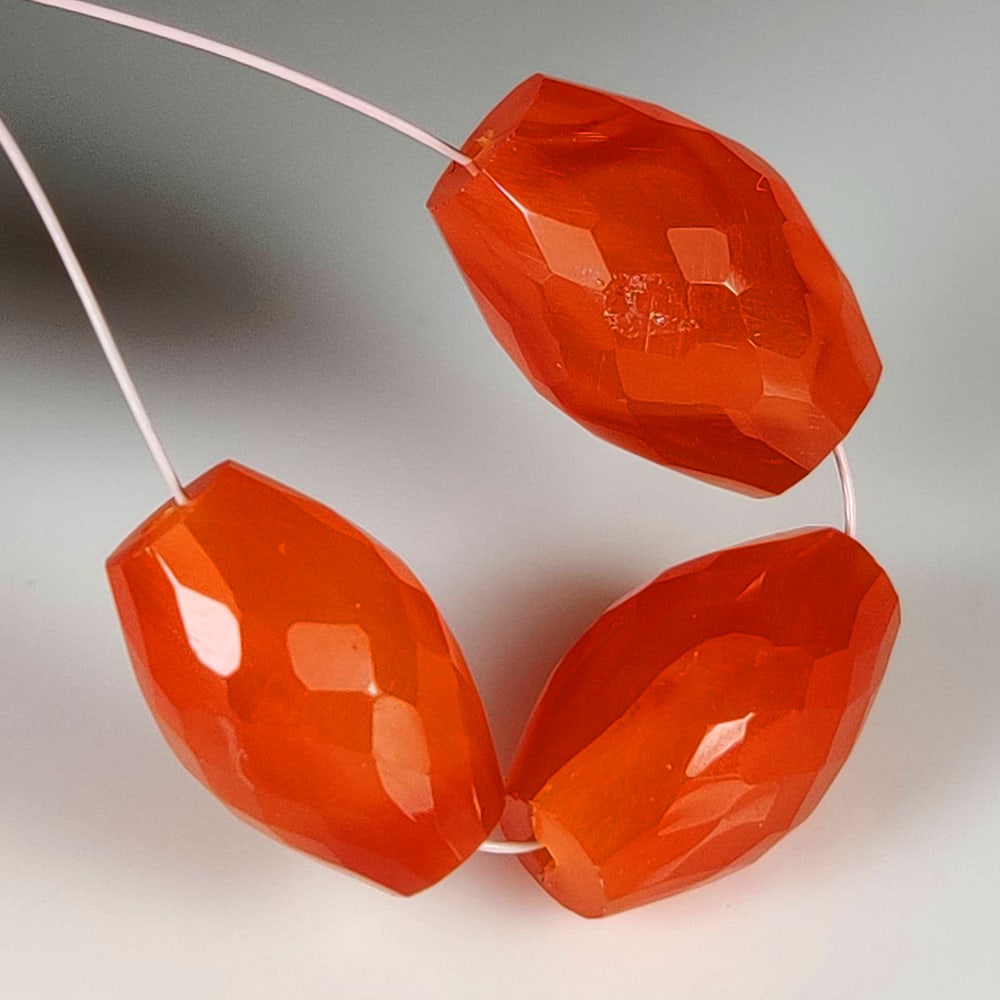 22.15 Ct Natural Orange Carnelian Dumble Beads: Weight - 22.15 Ct / Dimensions - 12.7x8.4 - 13.7x9.9 mm / 3 Pc's / Shape & Cut - Dumble Beads / Transparency - Semi - Opaque / Origin - Brazil