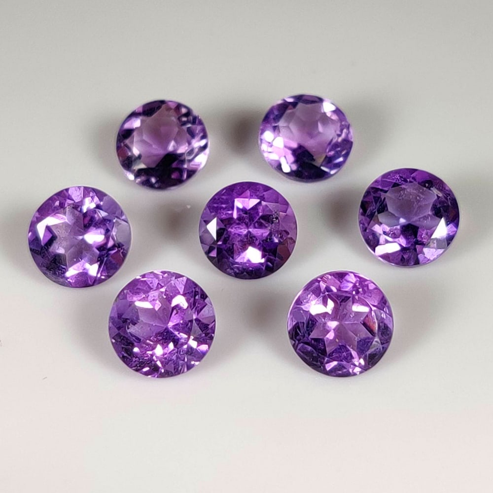 8.32 Ct Natural Purple Amethyst Round Cut Set: Weight - 8.32 Ct / Dimensions - 7.00 - 7.10 mm / 7 Pc's / Shape -Round Cut / Color - Purple / Clarity - VVS / Origin - Brazil / Treatment - Heated
