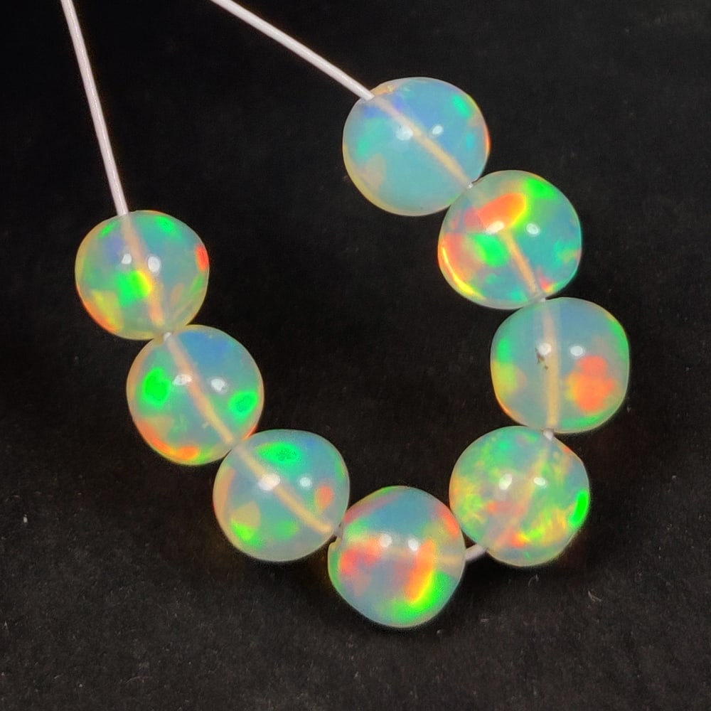 2.88 Ct Natural Multicolor Welo Opal Flash Fire Round Beads: Weight - 2.88 Ct / Dimensions - 4.20 - 4.60 mm / 8 Pc's / Shape & Cut - Drilled Round Beads / Color - Multicolor / Transparency - Translucent / Origin - Ethiopia / Comments - None