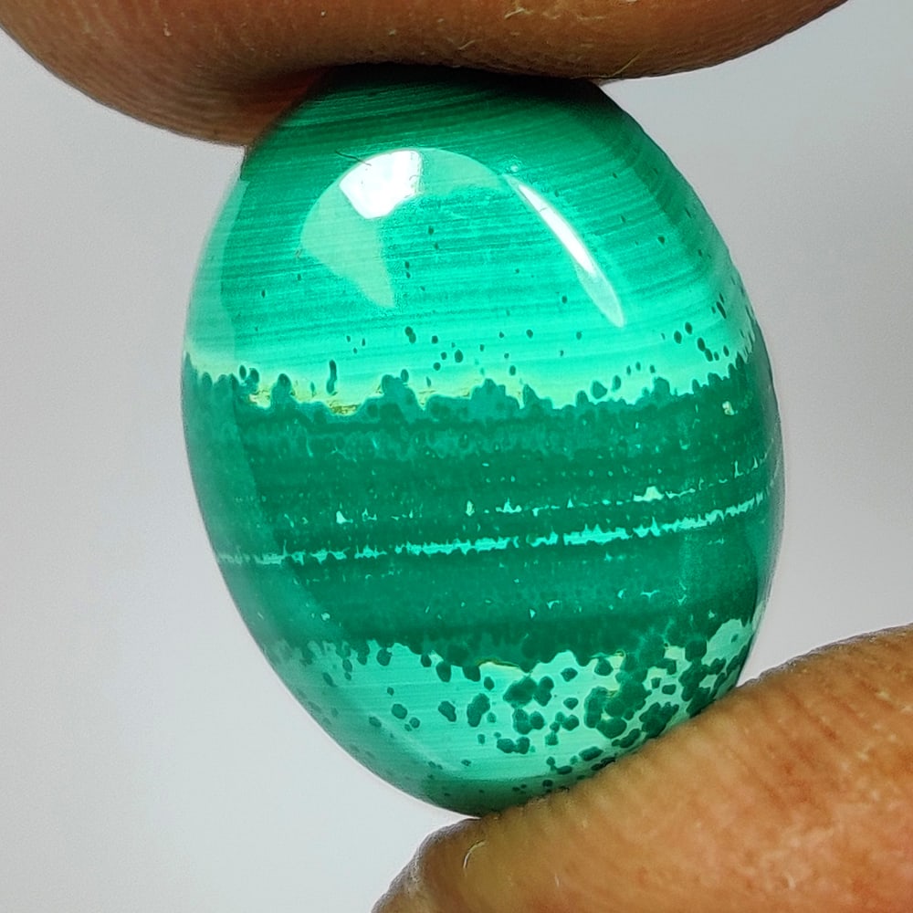 8.89 Ct Natural Green Malachite Oval Cab: Weight - 8.89 Ct / Dimensions - 14.20 x 10.30 x 5.20 mm / Shape - Oval Cab / Color - Green / Clarity - Opaque / Origin - Russia / Treatment - None