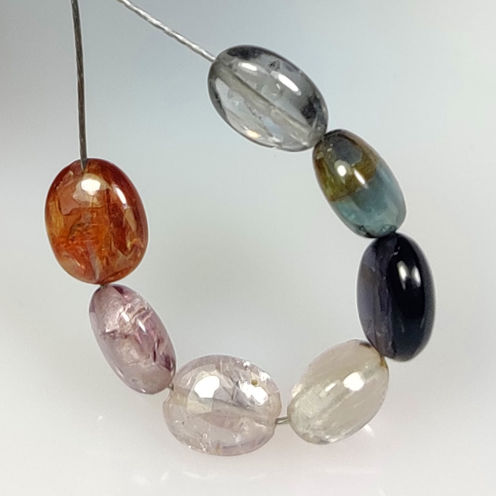 5.43 Ct Natural Multicolor Spinel Oval Beads: Weight - 5.43 Ct / Size - 5.4x4.7 - 5.9x5.0 mm / 7 Pc's / Shape - Oval Beads / Color - Multicolor / Clarity - SI / Origin - Mozambique / Treatment - None