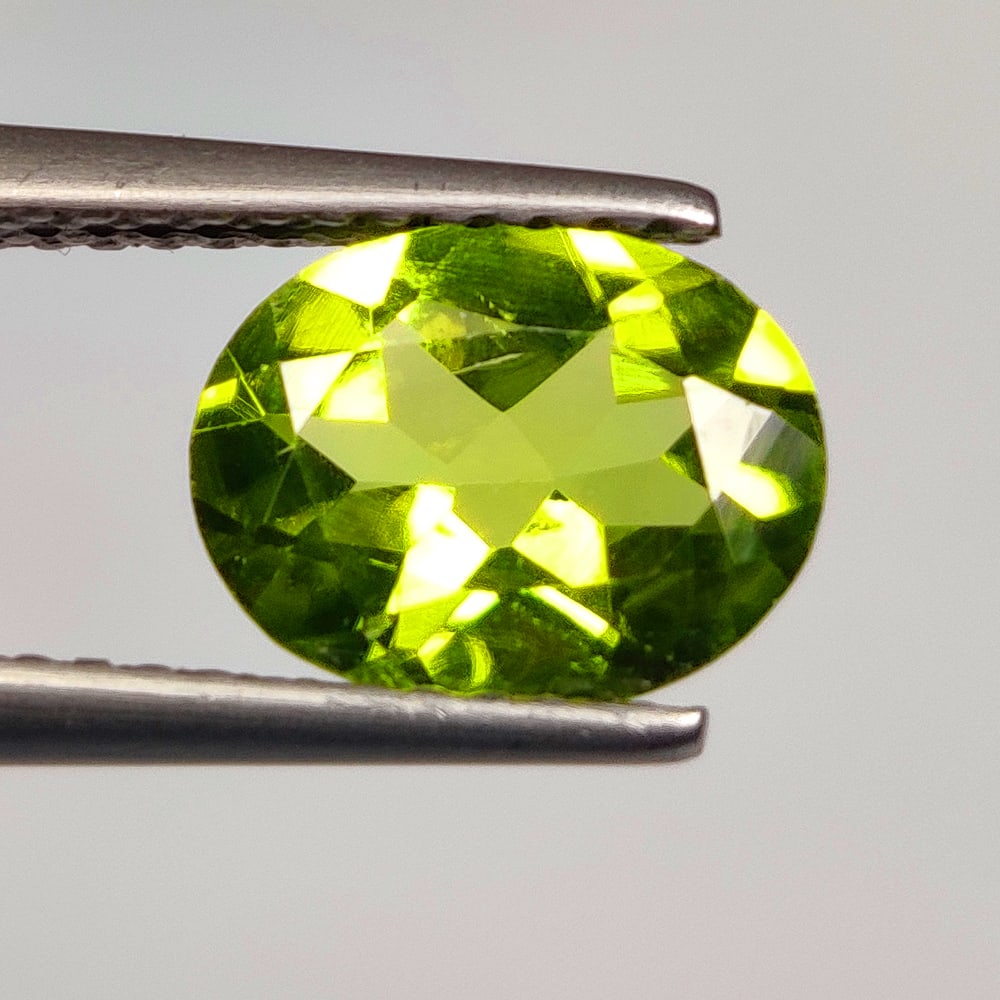 1.60 Ct Natural Green Peridot Oval Cut: Weight - 1.60 Ct / Dimensions - 9.10 x 7.20 x 3.80 mm / Shape - Oval Cut / Color - Green / Clarity - VVS / Origin - Pakistan / Treatment - None
