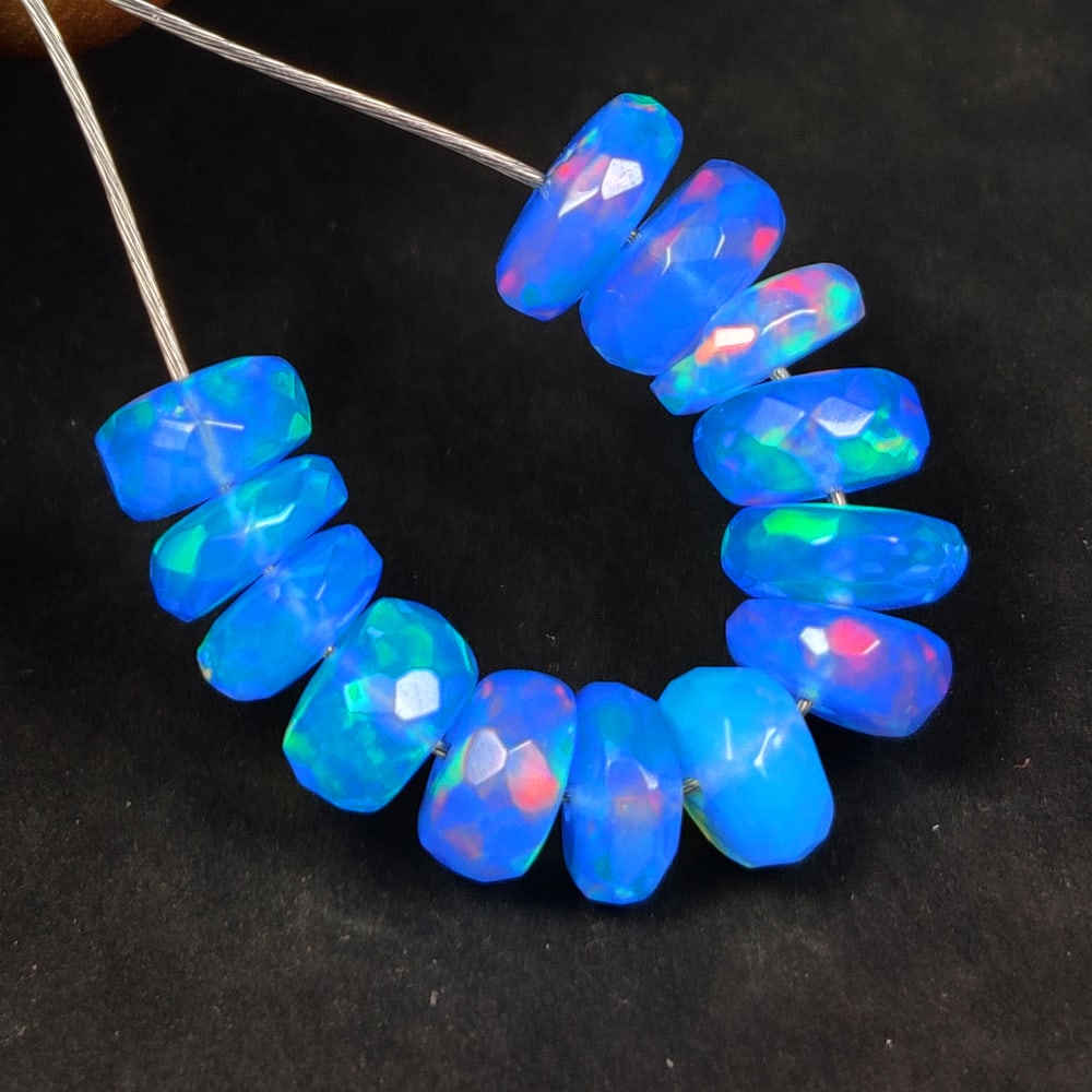 6.70 Ct Natural Blue Fire Opal Round Beads: Weight - 6.70 Ct / Size - 5.40 - 6.30 mm / 13 Pc's / Shape - Round Beads / Color - Blue / Clarity - Translucent / Origin - Ethiopia / Treatment - Color Heated