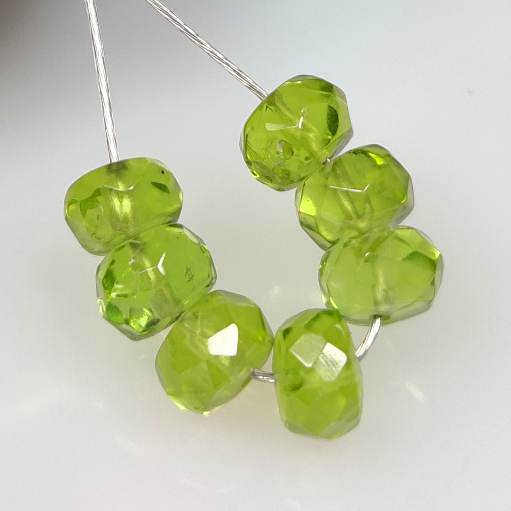 7.51 Ct Natural Green Peridot Round Beads: Weight - 7.51 Ct / Size - 5.10 - 5.40 mm / 7 Pc's / Shape - Round Beads / Color - Green / Clarity - VVS / Origin - Pakistan / Treatment - None