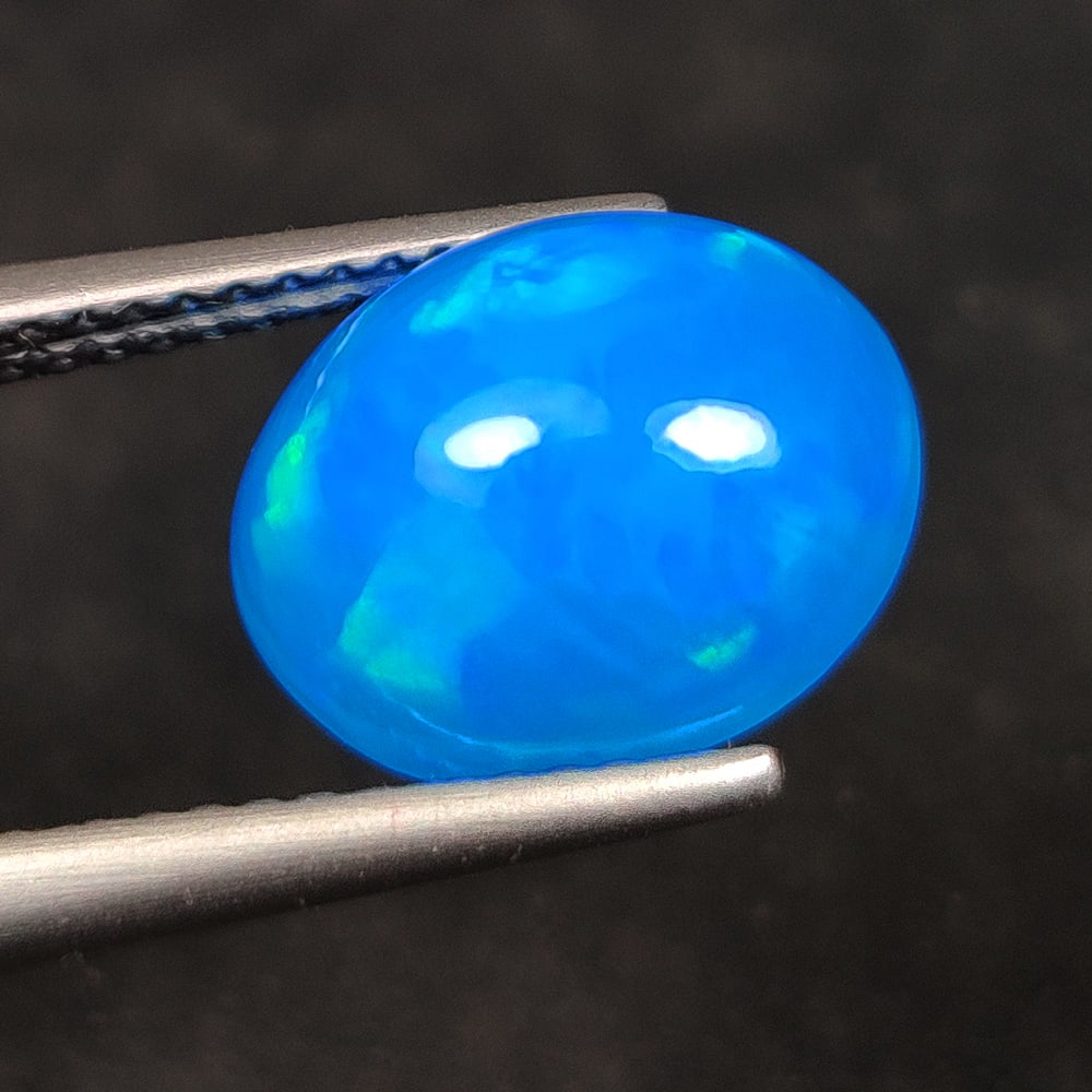 2.40 Ct Natural Blue Fire Opal Oval Cab (1 of 2)