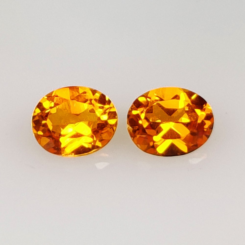 0.96 Ct Natural Orange Sapphire Oval Cut Pair: Weight - 0.96 Ct / Dimensions- 5.20 x 4.20 x 2.70 mm / 2 Pc's / Shape - Oval Cut / Clarity - VS / Origin - Sri Lanka / Treatment - Standard heated