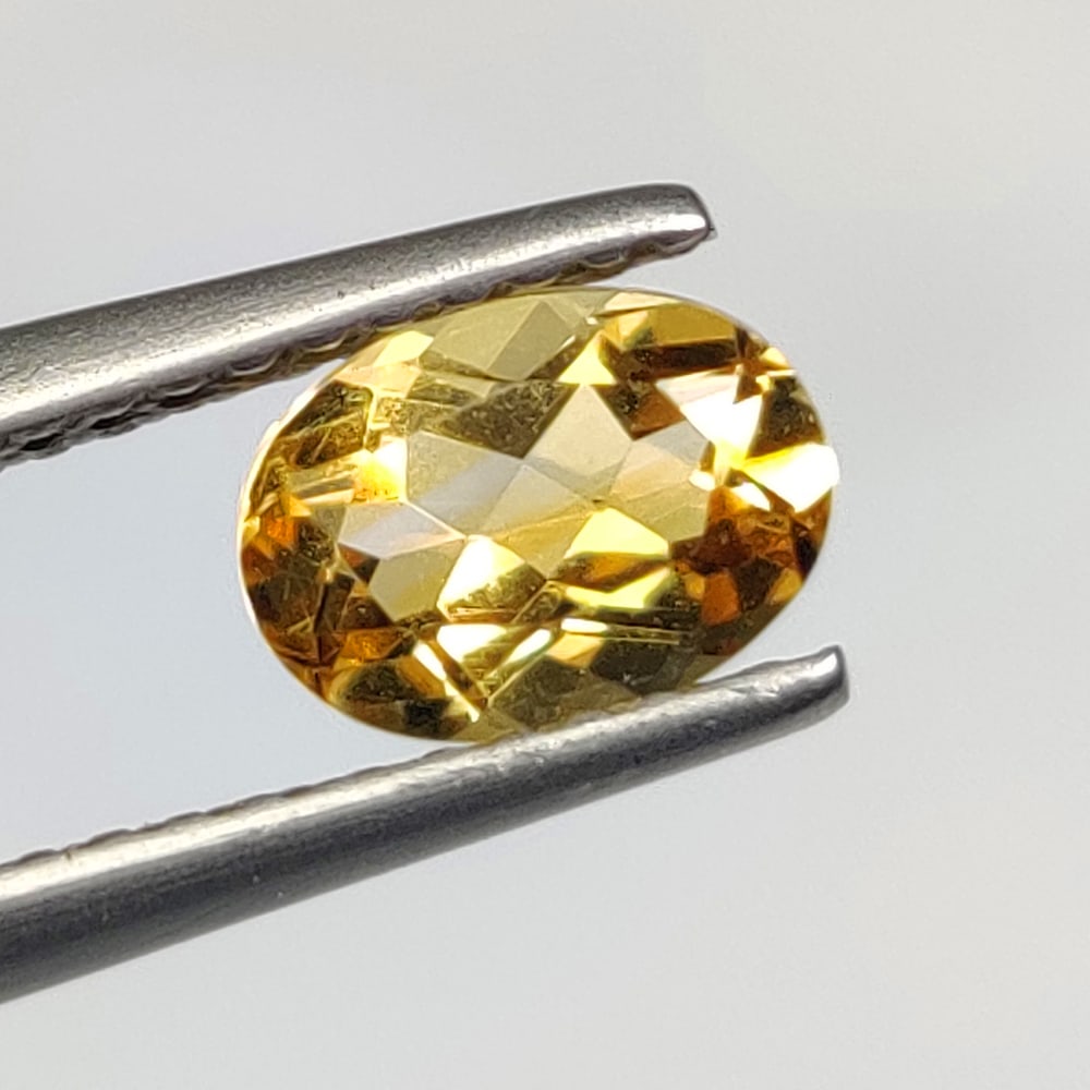 0.78 Ct Natural Yellow Citrine Oval Cut: Weight - 0.78 Ct / Size -7.00 x 5.10 x 3.70 mm / Shape - Oval Cut / Color - Yellow / Clarity - VVS / Origin - Brazil / Treatment - Heated