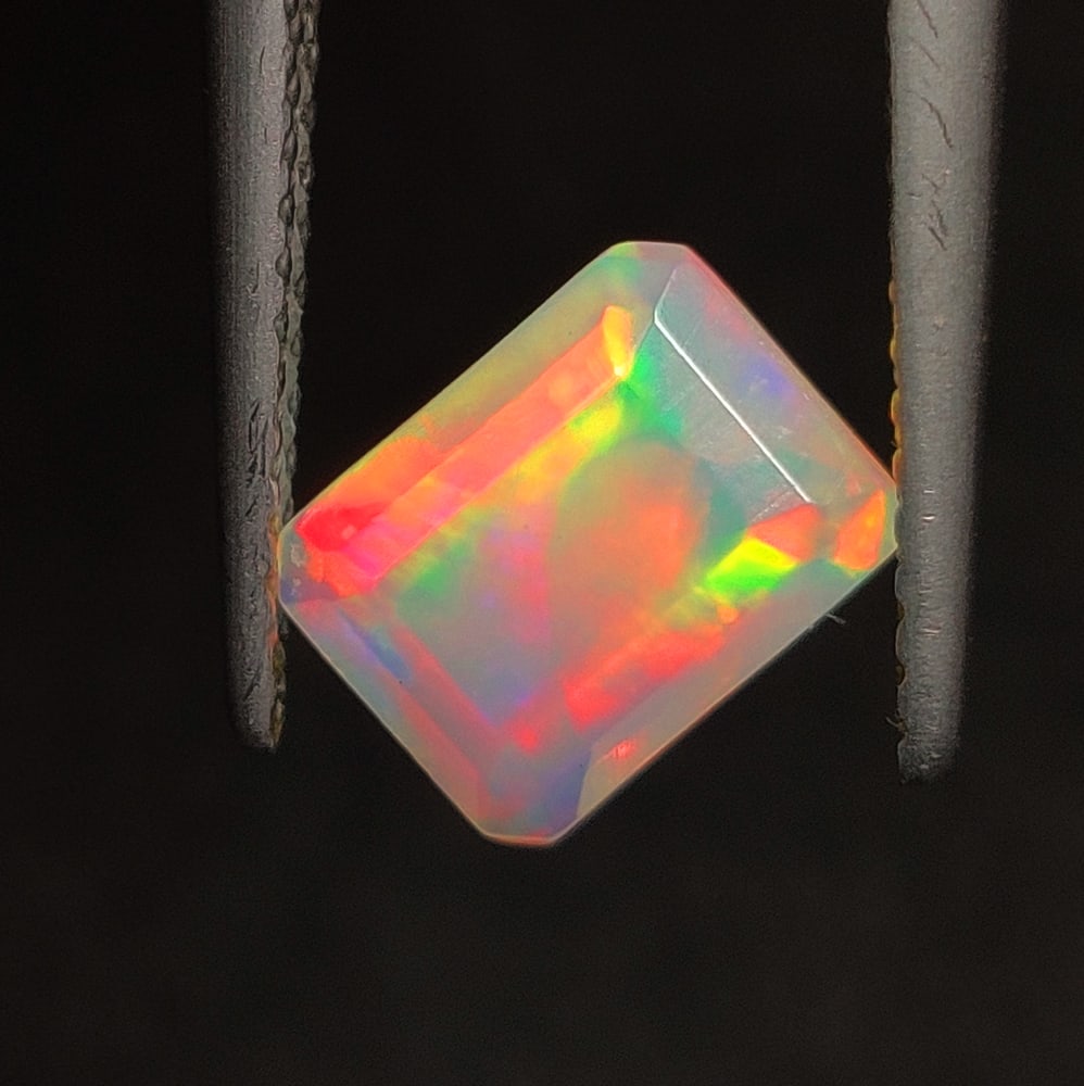 1.08 Ct Natural Multi-color Welo Opal Octagon Cut: Weight - 1.08 Ct / Size - 8.10 x 6.10 x 4.20 mm / Shape - Octagon Cut / Color - Multicolor / Clarity - Transparent / Origin - Ethiopia / Treatment - None