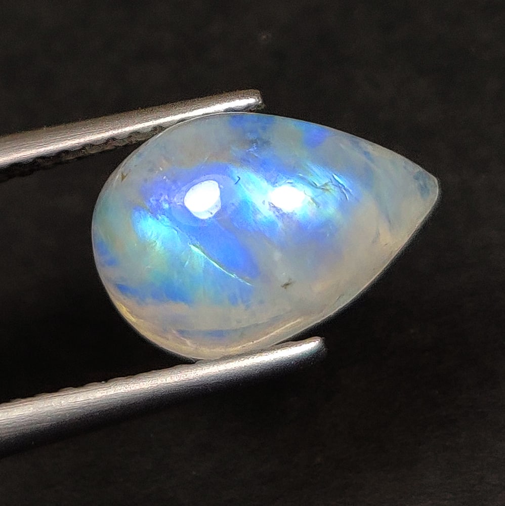 3.78 Ct Natural Blue Tint Moonstone Pear Cab: Weight - 3.78 Ct / Size - 12.00 x 8.20 x 5.40 mm / Shape - Pear Cab / Clarity -Transparent / Origin - India / Treatment - None