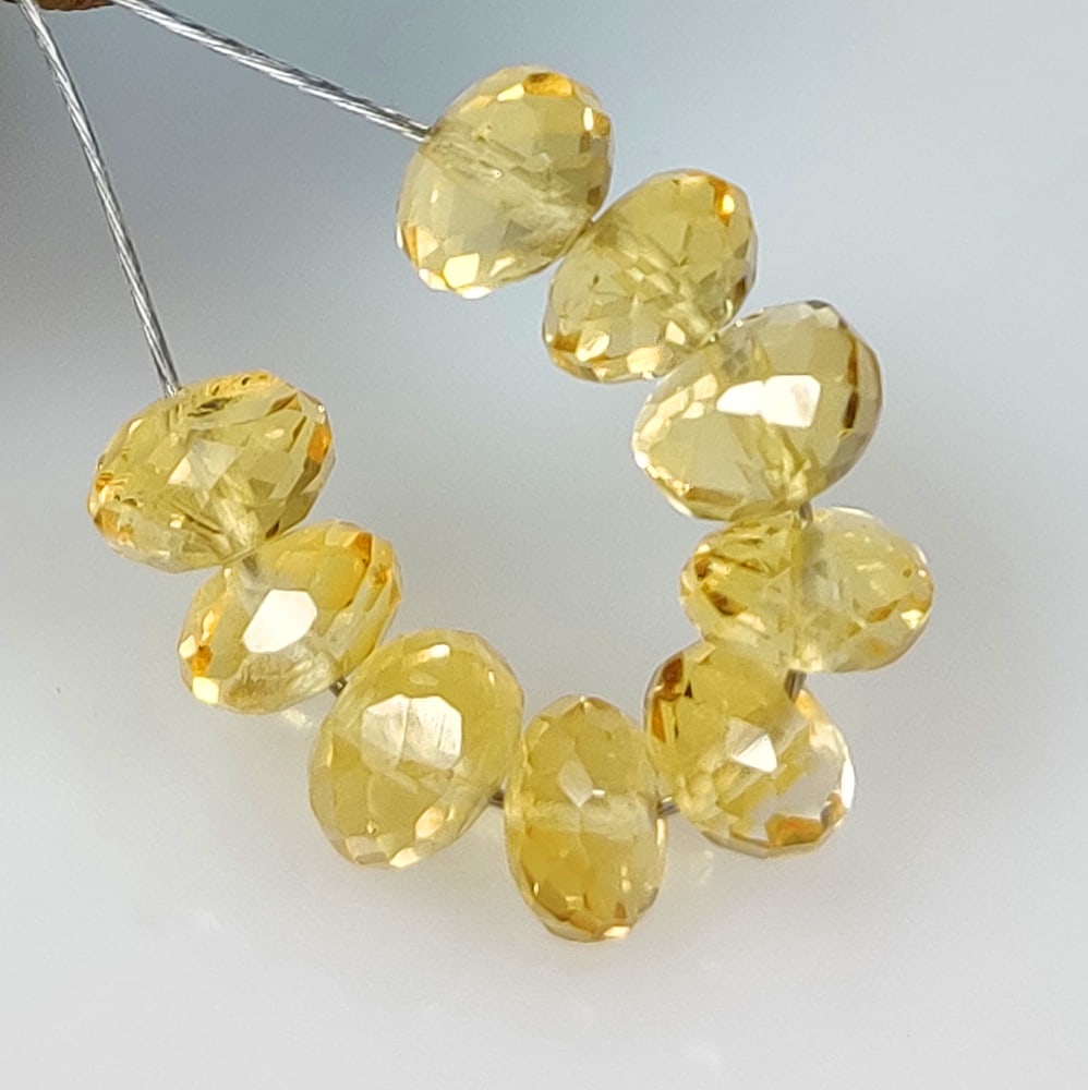8.71 Ct Natural Yellow Citrine Round Cut Beads: Weight - 8.71 Ct / Dimensions - 5.80 - 6.20 mm / 9 Pc's / Shape - Round Cut Beads / Color - Yellow / Clarity - VVS / Origin - Brazil / Treatment - Heated