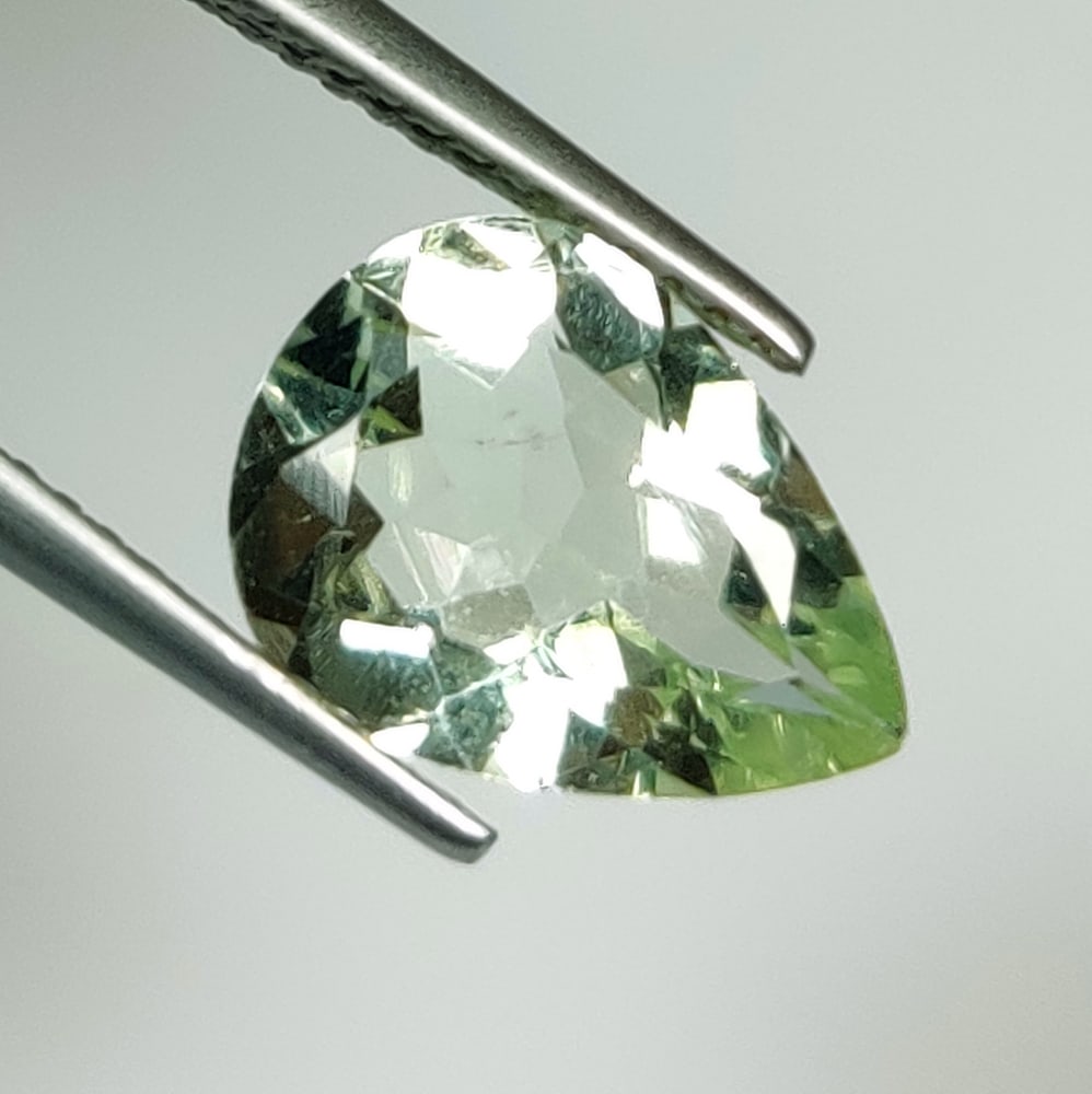 2.57 Ct Natural Green Amethyst Pear Cut: Weight - 2.57 Ct / Size - 11.80 x 8.80 x 5.00 mm / Shape - Pear Cut / Color - Green / Clarity - VVS / Origin - Brazil / Treatment - Heated