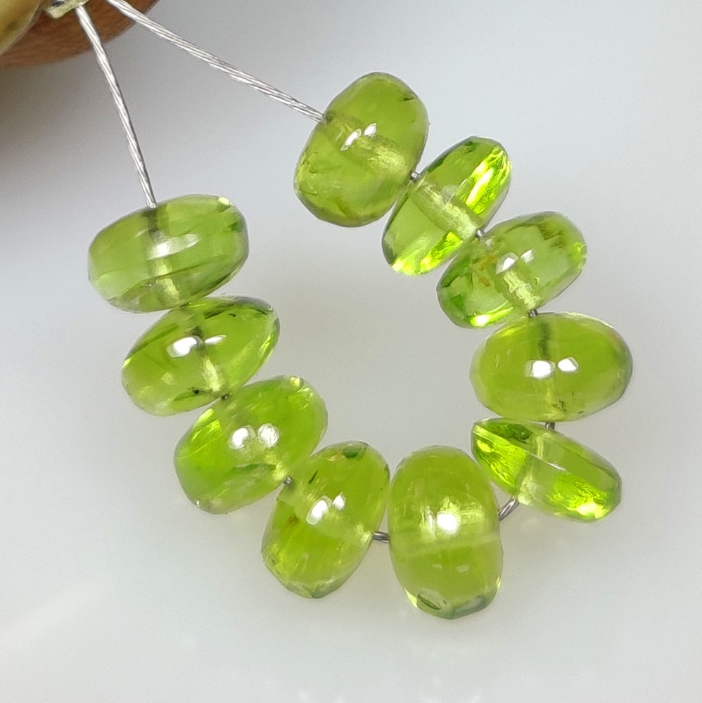 8.72 Ct Natural Green Peridot Round Beads: Weight - 8.72 Ct / Size - 5.20 - 5.50 mm / 10 PC's / Shape - Round Beads / Color - Green / Clarity - VVS / Origin - Pakistan / Treatment - None