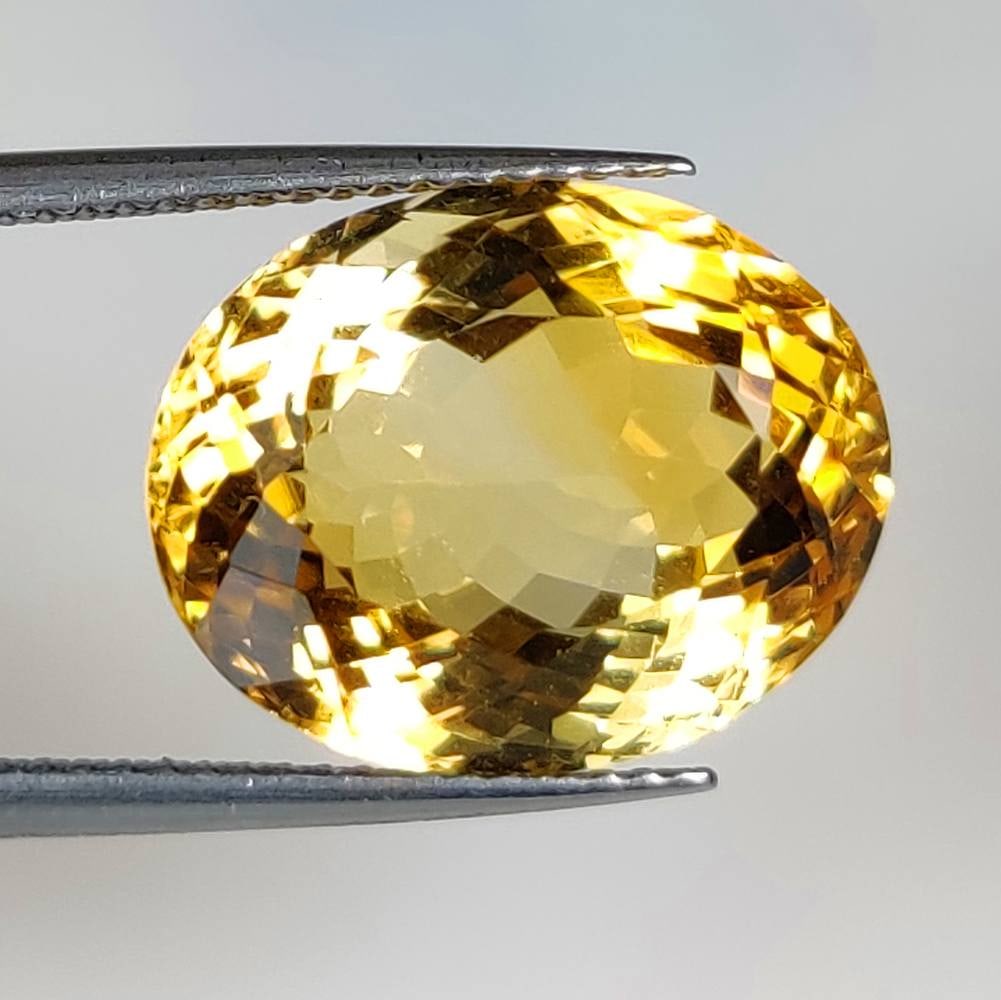 11.43 Ct Natural Yellow Citrine Oval Cut: Weight - 11.43 Ct / Size - 16.10 x 12.70 x 9.40 mm / Shape -Oval Cut / Color - Yellow / Clarity - VVS / Origin - Brazil / Treatment - Heated