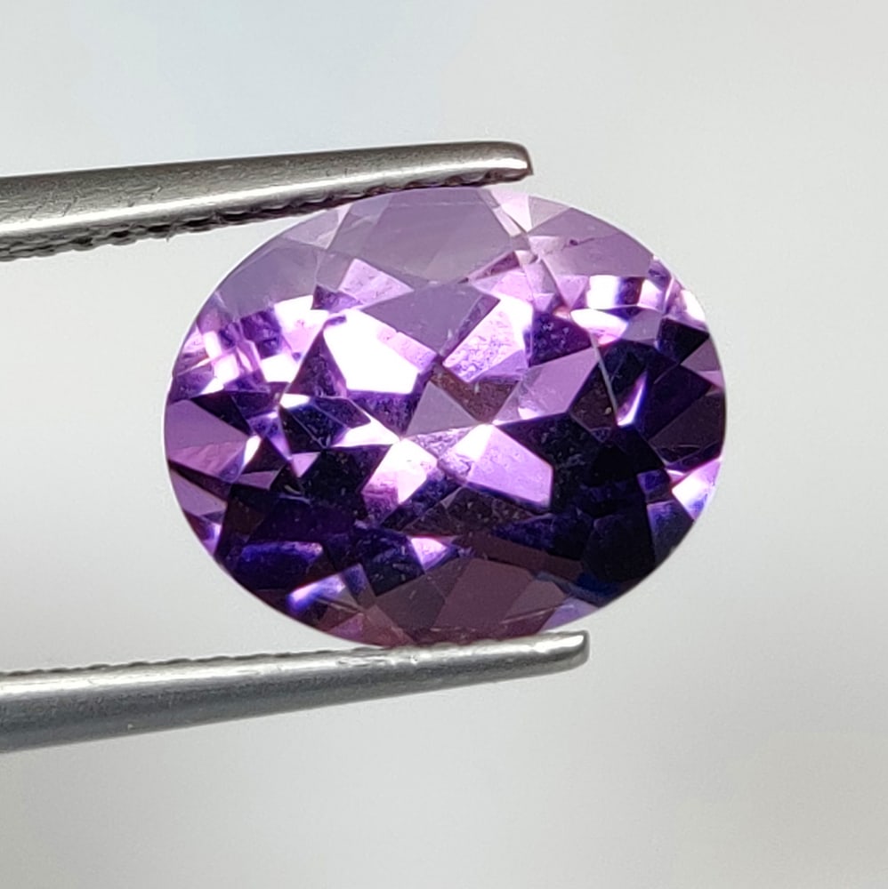 4.81 Ct Natural Purple Amethyst Oval Cut: Weight - 4.81 Ct / Size - 12.00 x 9.80 x 7.80 mm / Shape - Oval Cut / Color - Purple / Clarity - VVS / Origin -Brazil / Treatment - Heated
