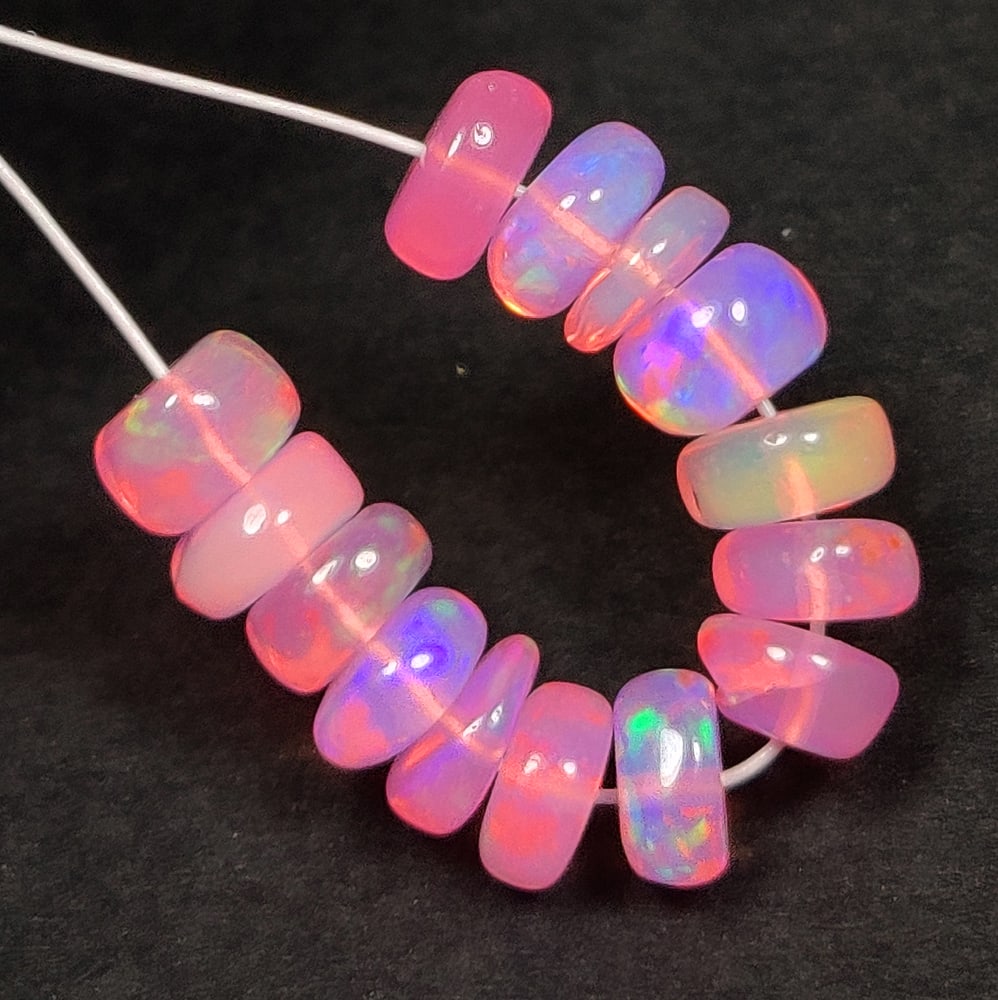 3.87 Ct Natural Pink FIre Opal Round Beads: Weight - 3.87 Ct / Dimensions - 4.50 - 5.00 mm / 14 Pc's / Shape & Cut - Drilled Round Beads / Color - Pink / Transparency - Translucent / Origin - Ethiopia / Comments - Color Heated