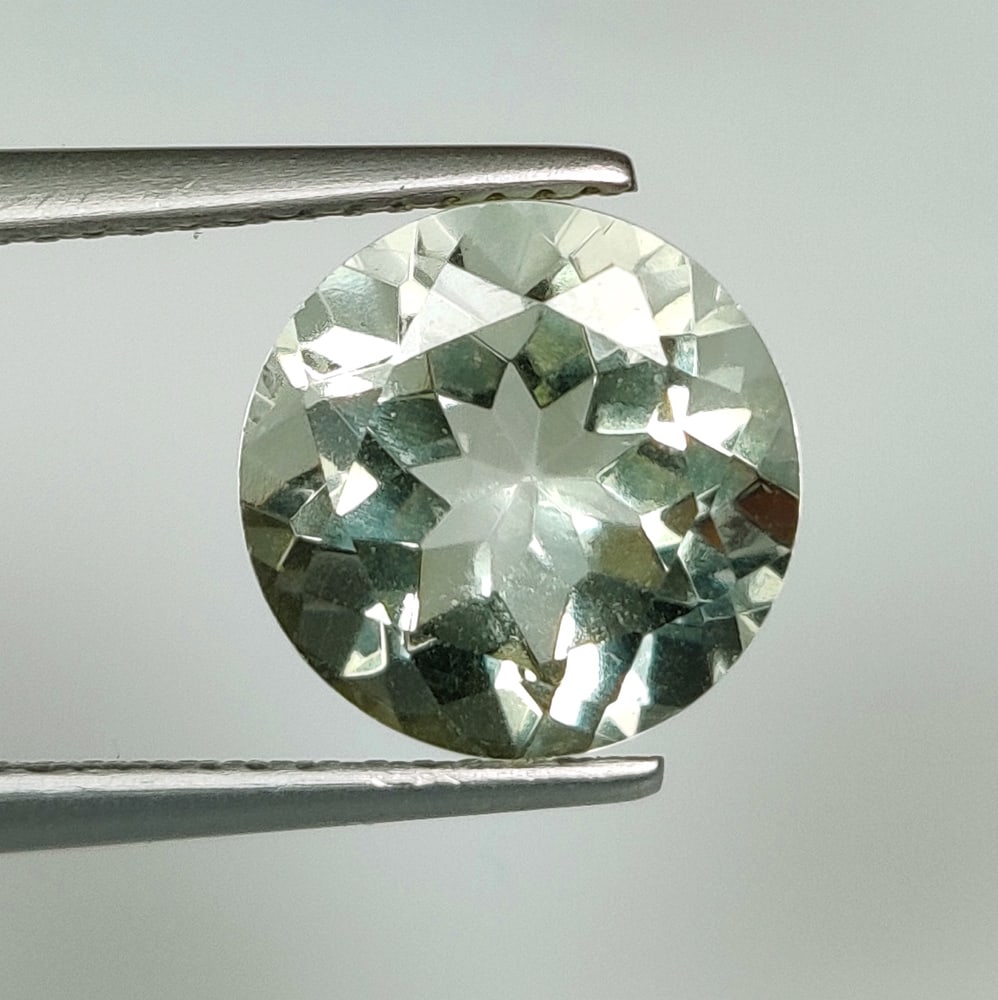 3.71 Ct Natural Green Amethyst Round Cut: Weight - 3.71 Ct / Size - 10.10 x 10.10 x 6.80 mm / Shape - Round Cut / Color - Green / Clarity - VVS / Origin - Brazil / Treatment - Heated
