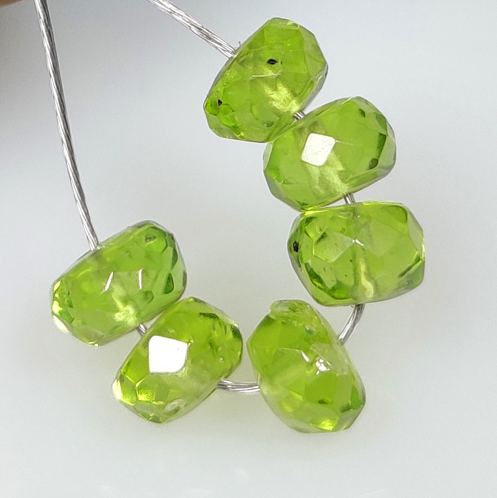6.12 Ct Natural Green Peridot Round Beads: Weight - 6.12 Ct / Size - 5.10 - 5.60 mm / 6 Pc's / Shape - Round Beads / Color - Green / Clarity - VVS / Origin - Pakistan / Treatment - None