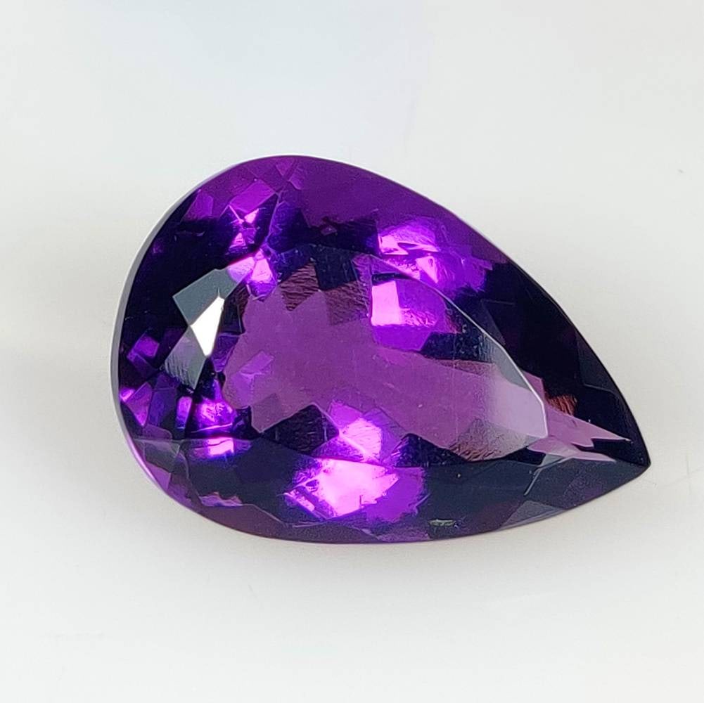 13.76 Ct Natural Purple Amethyst Pear Cut: Weight - 13.76 Ct / Size - 19.90 x 13.50 x 10.00 mm / Shape - Pear Cut / Color - Purple / Clarity - VVS / Origin -Brazil / Treatment - Heated