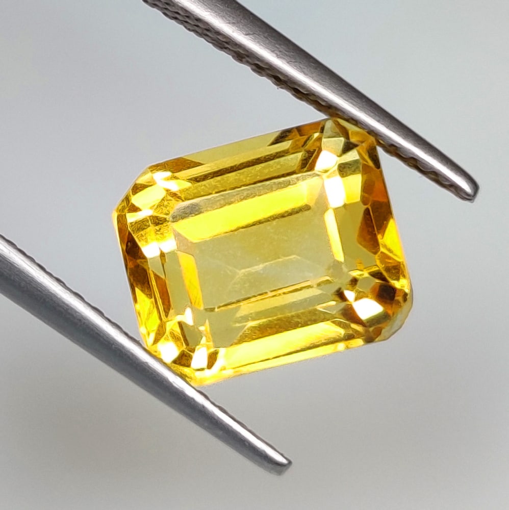 3.87 Ct Natural Yellow Citrine Octagon Cut: Weight - 3.87 Ct / Size - 9.70 x 8.20 x 6.70 mm / Shape - OCtagon Cut / Color - Orangish Yellow / Clarity - VVS / Origin - Brazil / Treatment - Heated