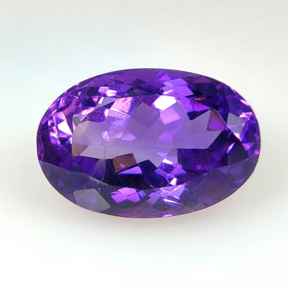 12.12 Ct Natural Purple Amethyst Oval Cut: Weight - 12.12 Ct / Size - 17.40 x 11.70 x 9.90 mm / Shape - Oval Cut / Color - Purple / Clarity - VVS / Origin -Brazil / Treatment - Heated