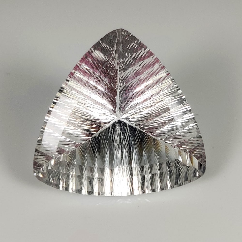 32.39 Ct Natural Colorless Topaz Trillion Cut: Weight - 32.39 Ct / Dimensions - 25.00 x 25.00 x 13.10 mm / Shape & Cut - Trillion Cut / Transparency - VVS / Origin - Brazil / Comments - None