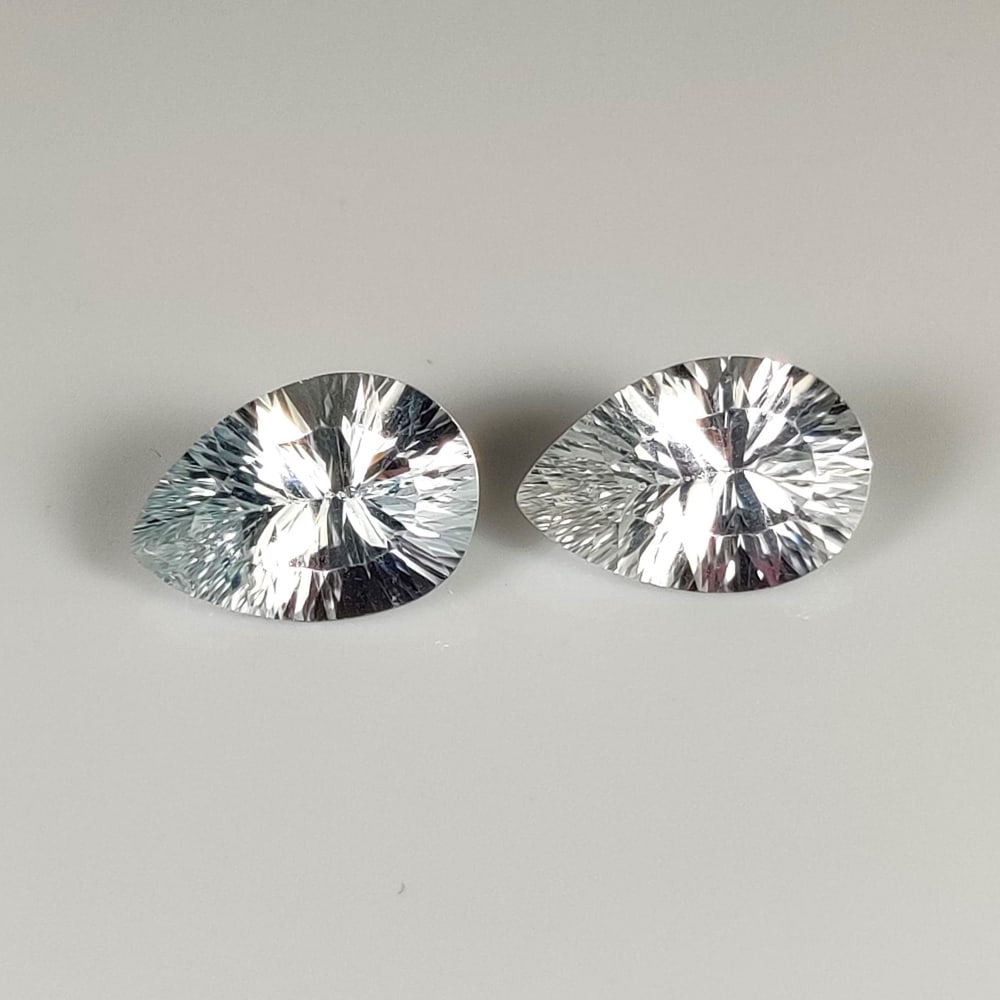 6.54 Ct Natural Colorless Topaz Pear Concave Cut Pair: Weight - 6.54 Ct / Dimensions - 12.00 x 8.00 x 5.20 mm / 2 Pc's / Shape & Cut - Pear Concave Cut / Color - White / Transparency - VVS / Origin - Brazil / Comments - None