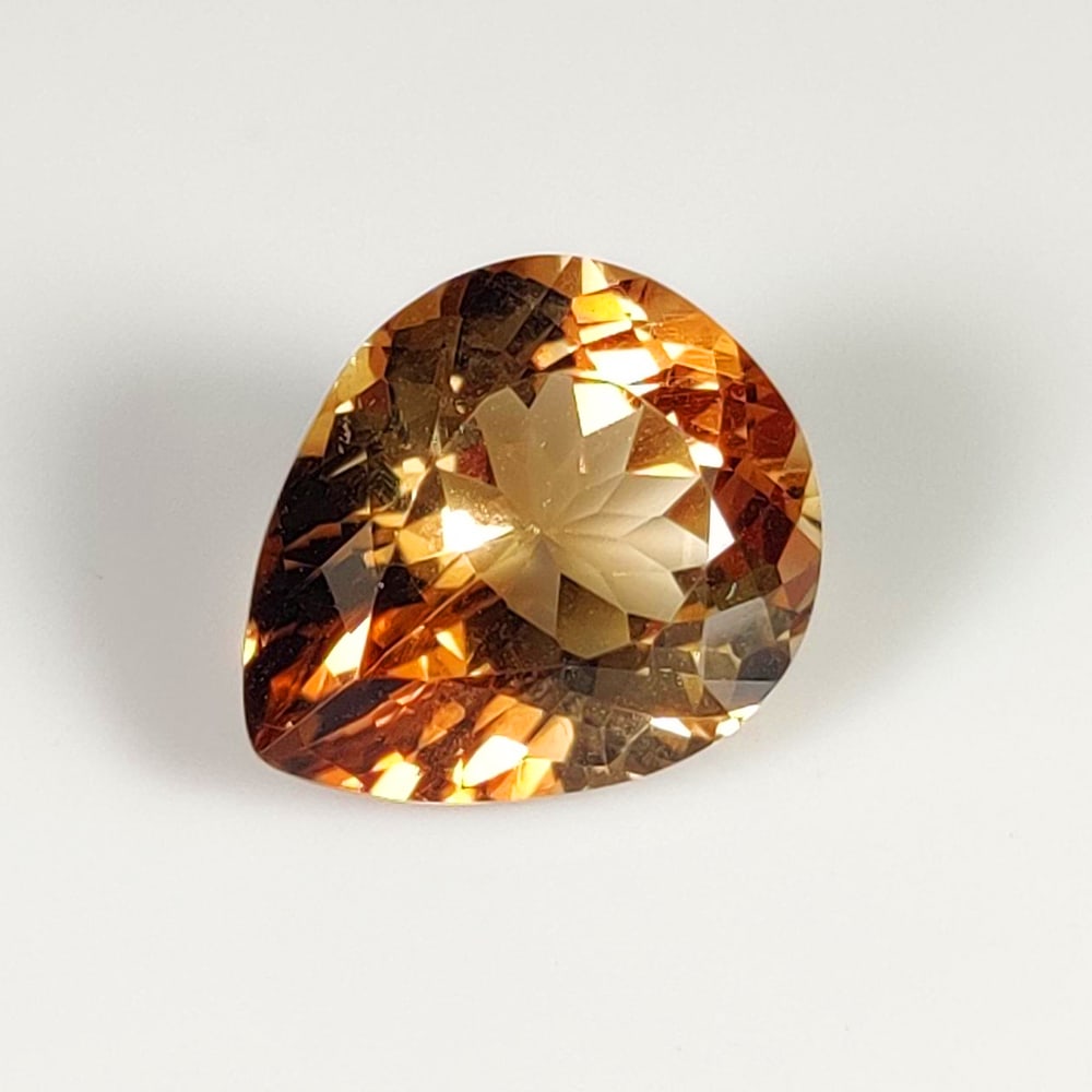 7.46 Ct Natural Champagne Topaz Pear Cut: Weight - 7.46 Ct / Dimensions - 13.00 x 11.00 x 7.30 mm / Shape - Pear Cut / Clarity - VVS / Origin - Brazil / Comments - Heated