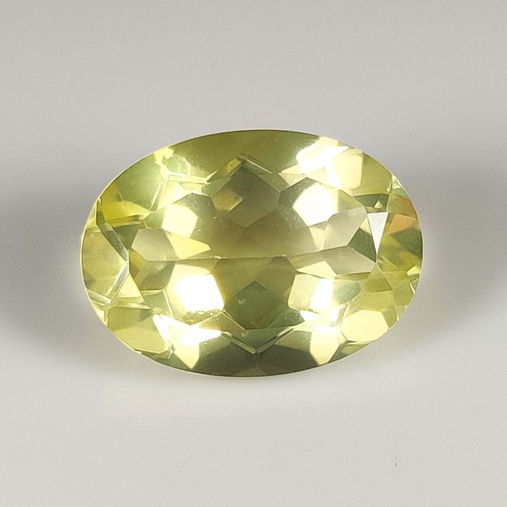 11.83 Ct Natural Lemon Quartz Oval Cut: Weight - 11.83 Ct / Dimensions - 18.00 x 13.00 x 8.50 mm / Shape - Oval Cut / Clarity - VVS / Origin - Brazil / Treatment - Heated