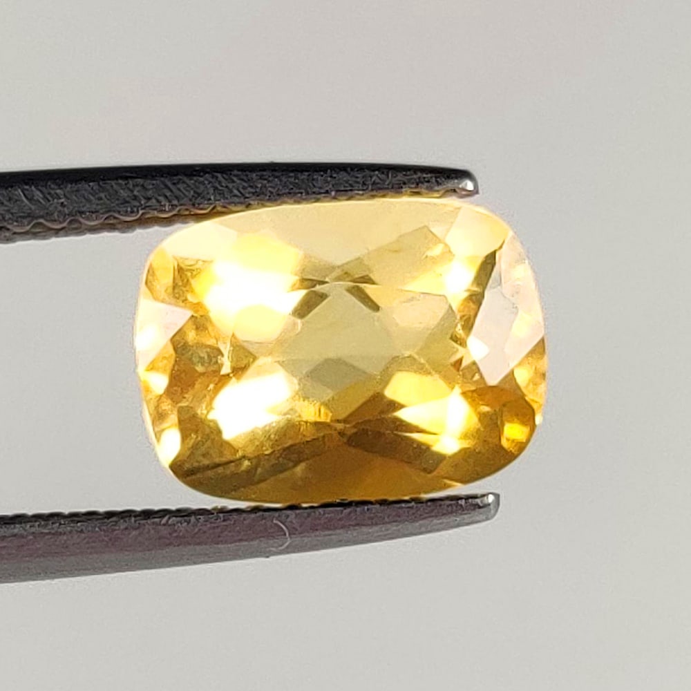 1.94 Ct Natural Yellow Citrine Cushion Cut: Weight - 1.94 Ct / Dimensions - 10.00 x 7.00 x 5.50 mm / Shape - Cushion Cut / Color - Yellow / Clarity - VVS / Origin - Brazil / Treatment - Heated