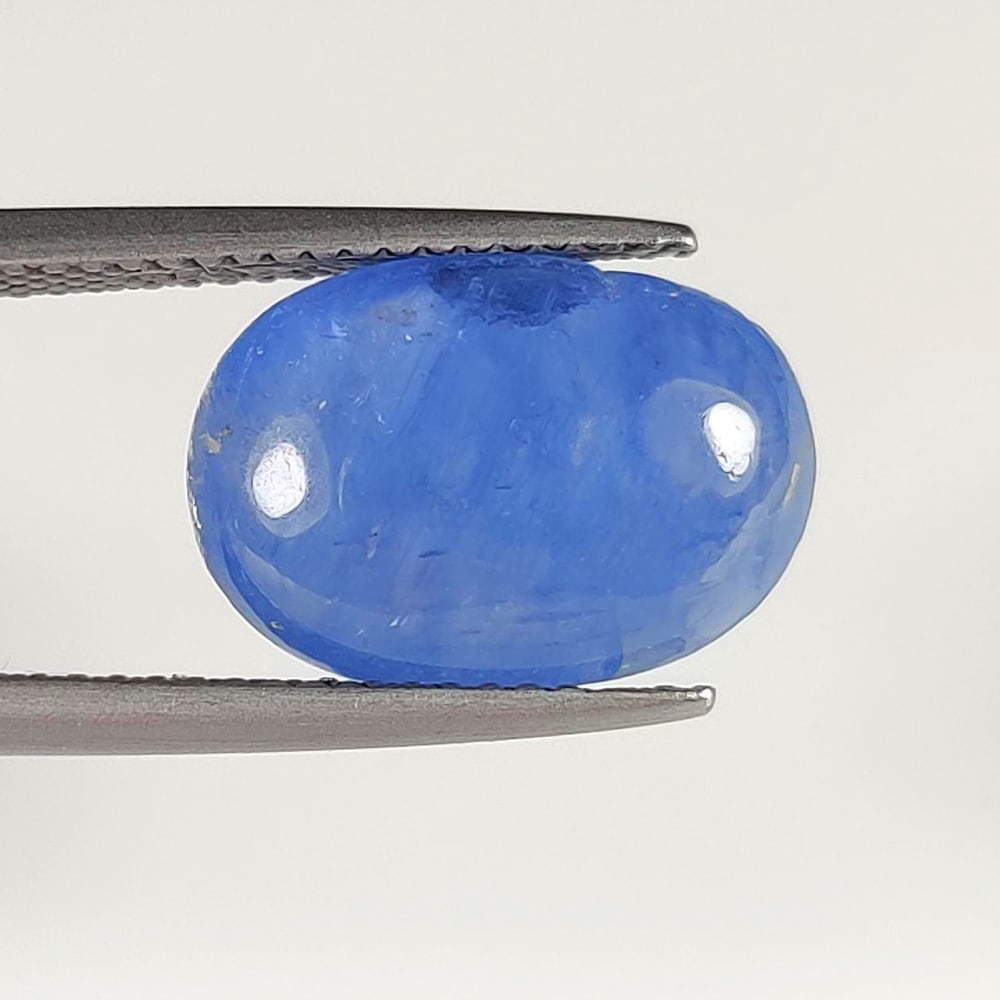 6.00 Ct Natural Blue Sapphire Oval Cab: Weight - 6.00 Ct / Size- 14.00 x 10.00 x 5.80 mm / Shape - Oval Cab / Clarity - Opaque / Origin - Sri Lanka / Treatment - Diffused
