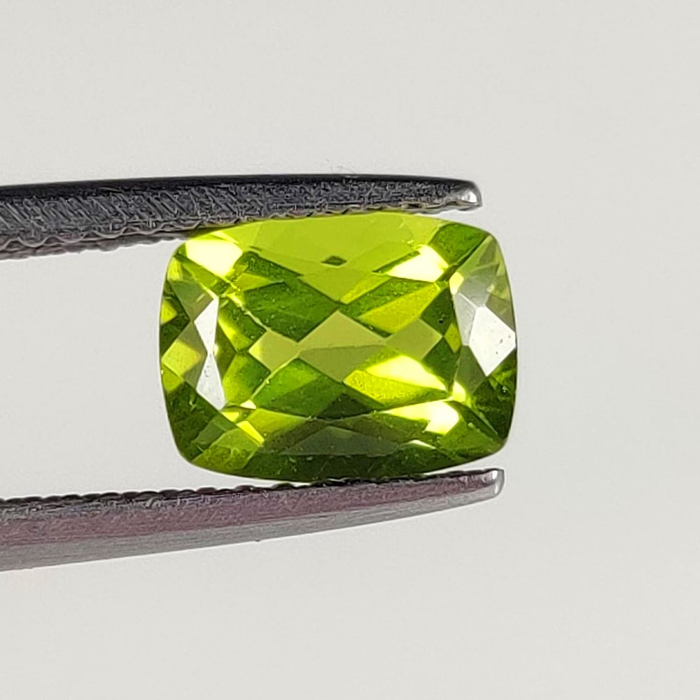 1.71 Ct Natural Green Peridot Cushion Cut: Weight - 1.71 Ct / Dimensions - 8.30 x 6.30 x 4.50 mm / Shape - Cushion Cut / Color - Green / Clarity - VVS / Origin - Pakistan / Treatment - None