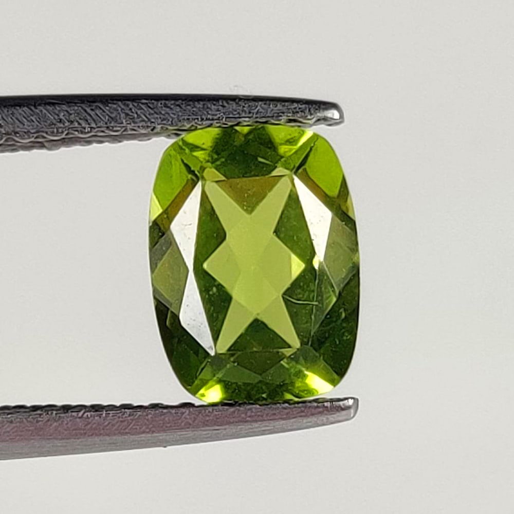 1.55 Ct Natural Green Peridot Cushion Cut: Weight - 1.55 Ct / Dimensions - 8.00 x 6.00 x 3.70 mm / Shape - Cushion Cut / Color - Green / Clarity - VVS / Origin - Pakistan / Treatment - None