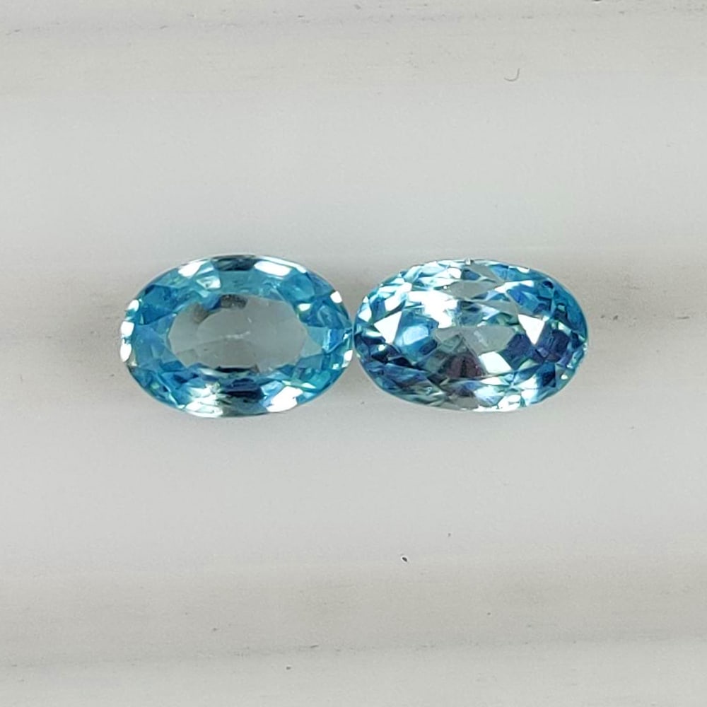 1.48 Ct Natural Blue Zircon OVal Cut Pair: Weight - 1.48 Ct / Size - 5.50 x 4.00 x 2.30 mm / 2 PC's / Shape - Oval Cut / Color - Blue / Clarity - VVS / Origin - Cambodia / Treatment - Gentle Heat