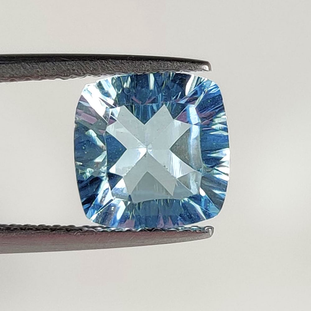 3.30 Ct Natural Blue Topaz Cushion Cut: Weight - 3.30 Ct / Dimensions - 9.00 x 9.00 x 5.00 mm / Shape - Cushion Cut / Color - Blue / Clarity - VVS / Origin - Brazil / Treatment - Irradiated