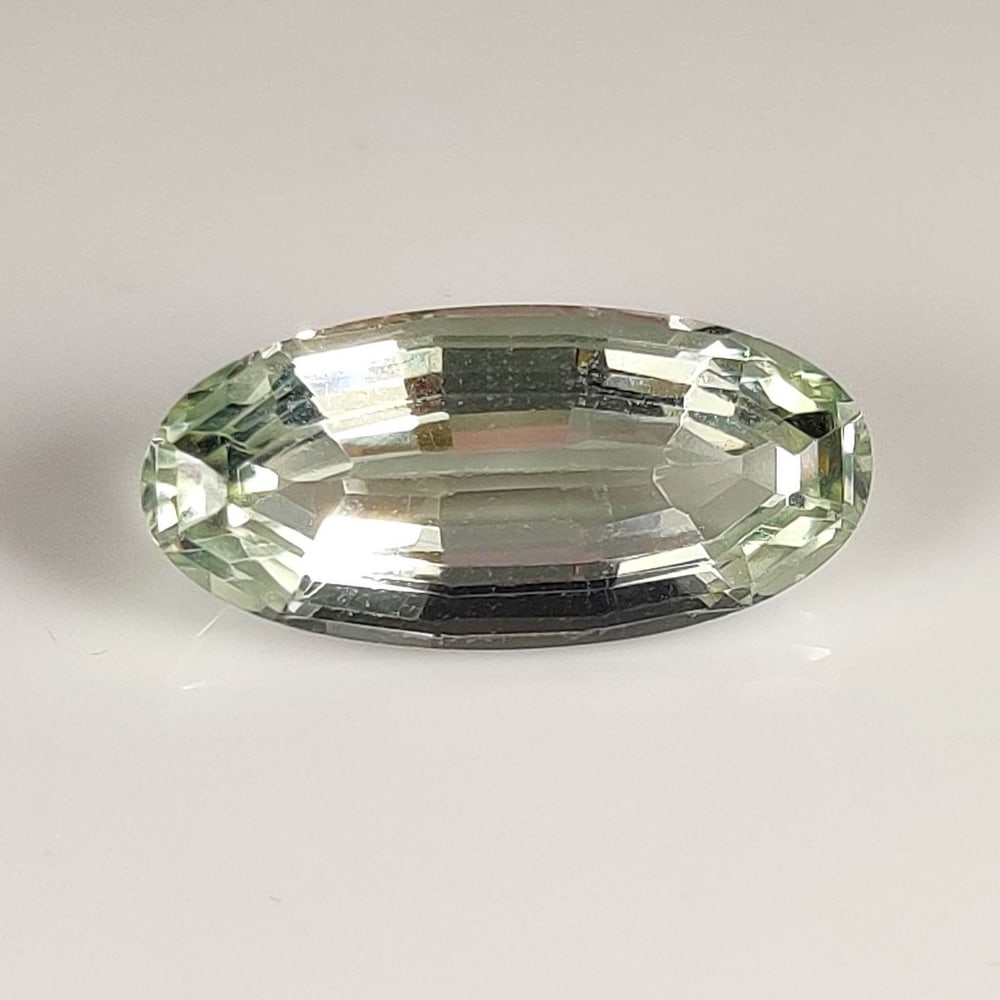 6.17 Ct Natural Green Amethyst OVal Cut: Weight - 6.17 Ct / Dimensions - 18.00 x 8.50 x 6.30 mm / Shape - OVal Cut / Color - Green / Clarity - VVS / Origin - Brazil / Treatment - Heated