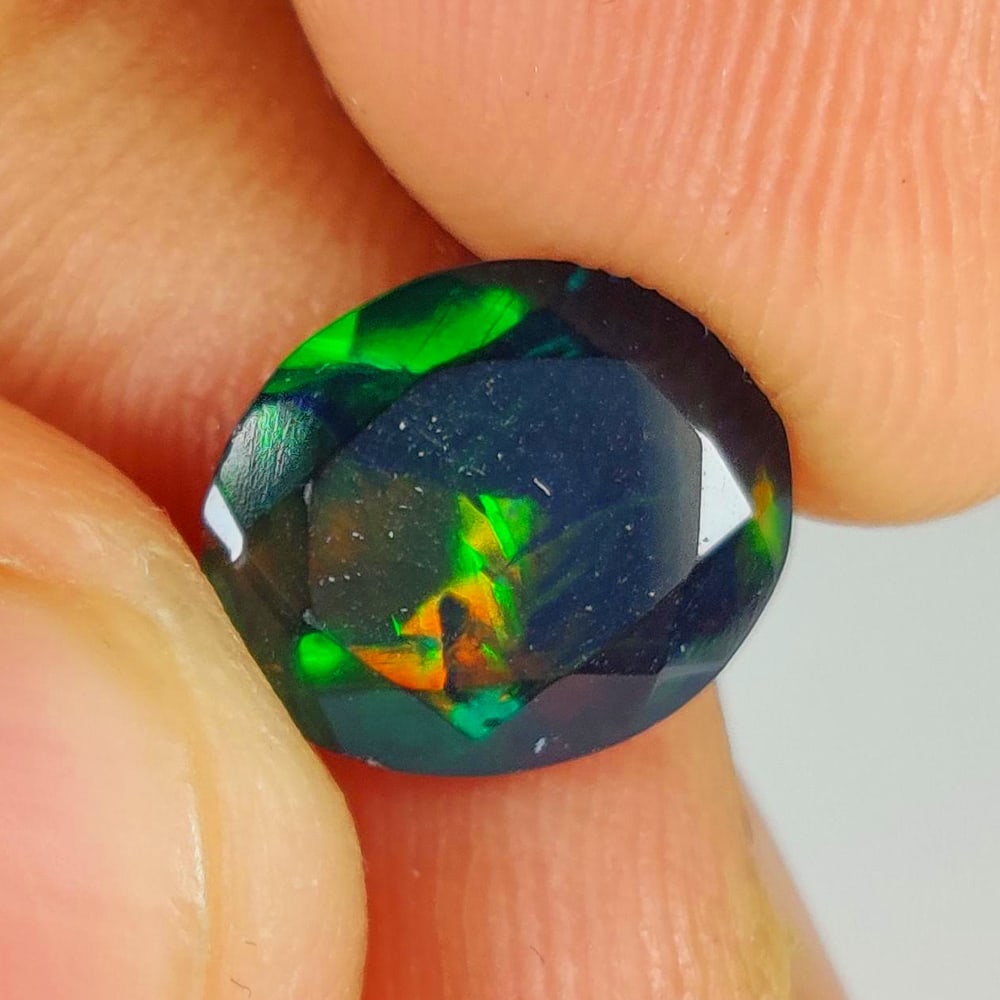 1.50 Ct Natural Black Flashing Fire Opal Oval Cab (1 of 2)