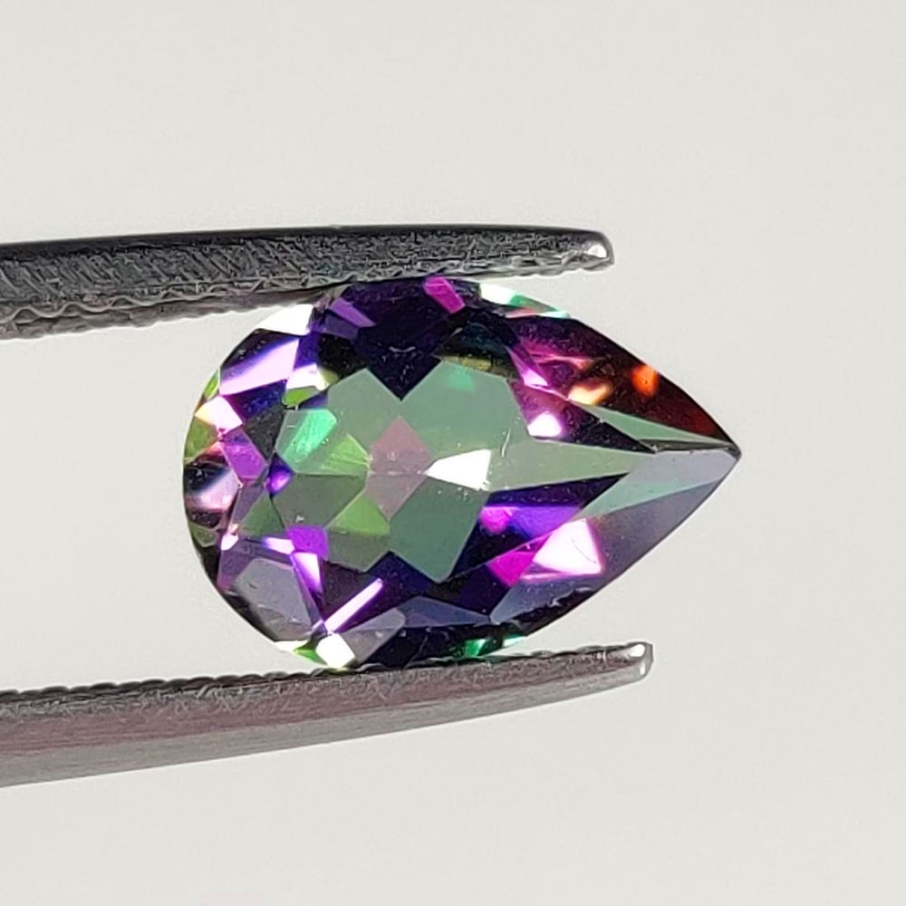 2.13 Ct Natural Mystic Topaz Pear Cut: Weight - 2.13 Ct / Size -10.00 x 7.30 x 4.50 mm / Shape - Pear Cut / Color - Multicolor / Clarity - VVS / Origin - Brazil / Treatment - Color Coated
