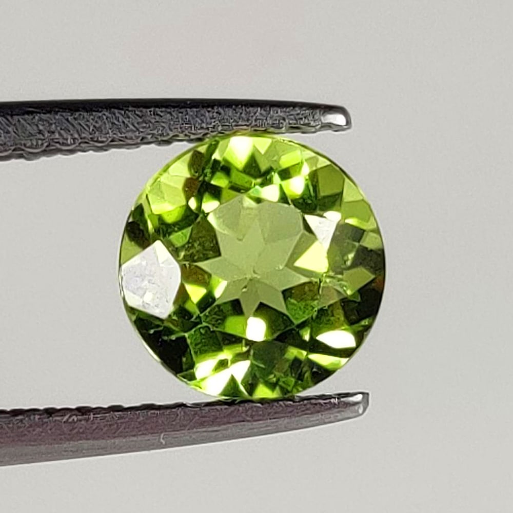 1.60 Ct Natural Green Peridot Round Cut: Weight - 1.60 Ct / Size - 7.20 x 7.20 x 4.60 mm / Shape - Round Cut / Color - Green / Clarity - SI / Origin - Pakistan / Treatment - None