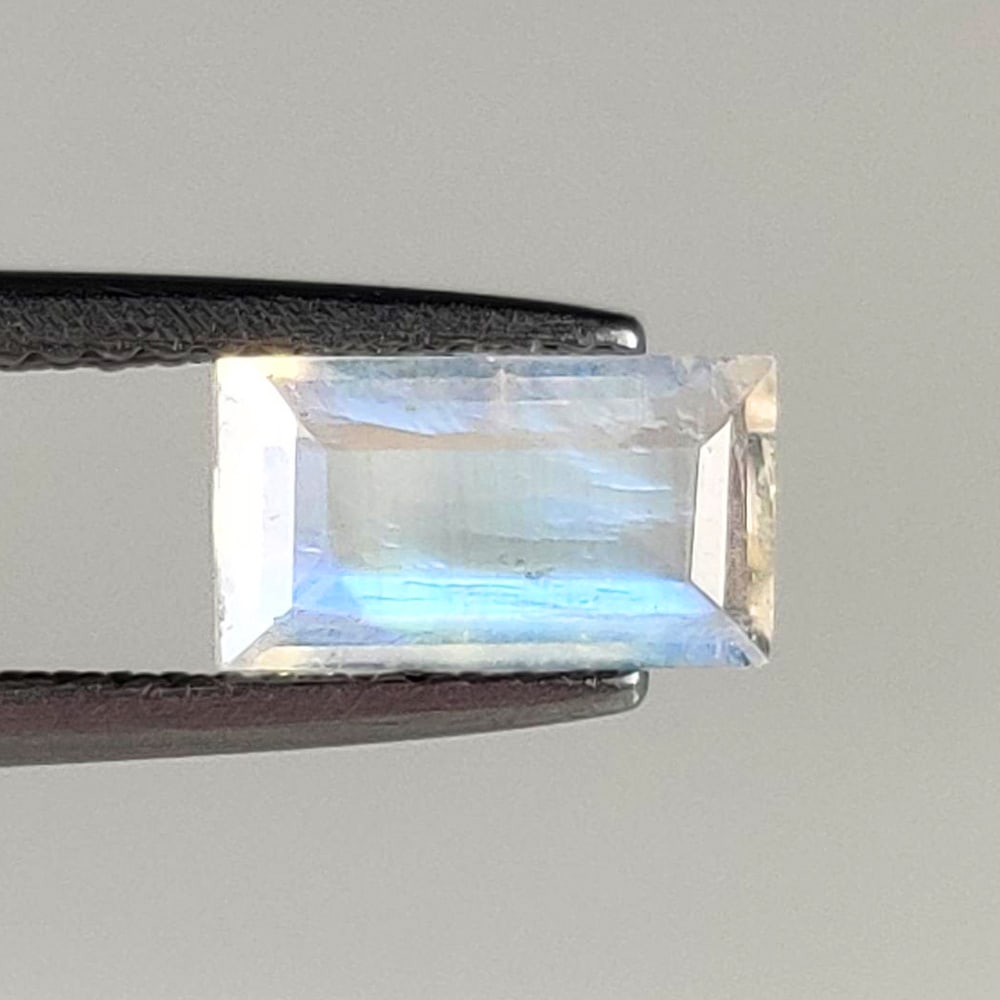 1.20 Ct Natural Blue Tint Moonstone Rectangle Cut: Weight - 1.20 Ct / Size - 9.00 x 5.00 x 3.00 mm / Shape - Rectangle Cut / Clarity - Semi-Transparent / Origin - India / Treatment - None