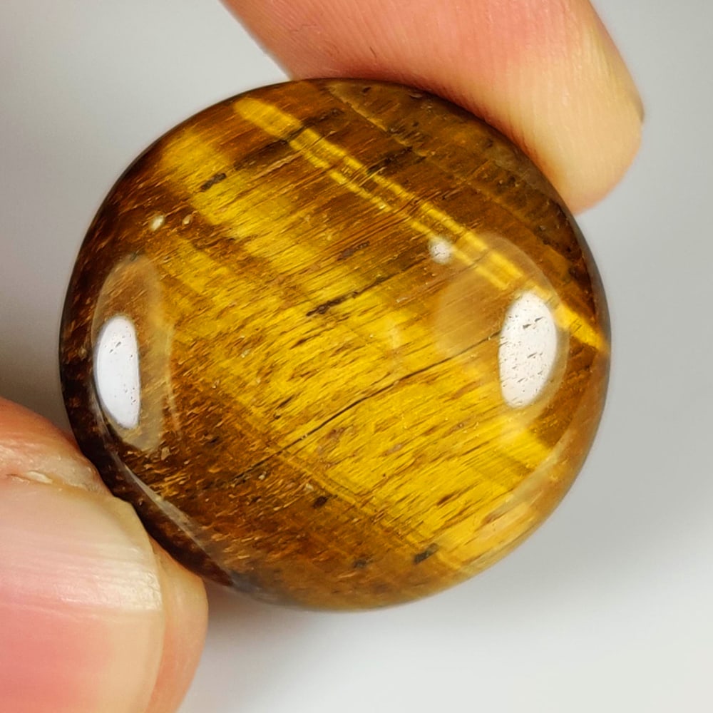 26.94 Ct Natural Tiger Eye Round Cab: Weight - 26.94 Ct / Dimensions - 23.00 x 23.00 x 5.50 mm / Top Class Quality / Round Cab / Origin - Burmese / Comments - None