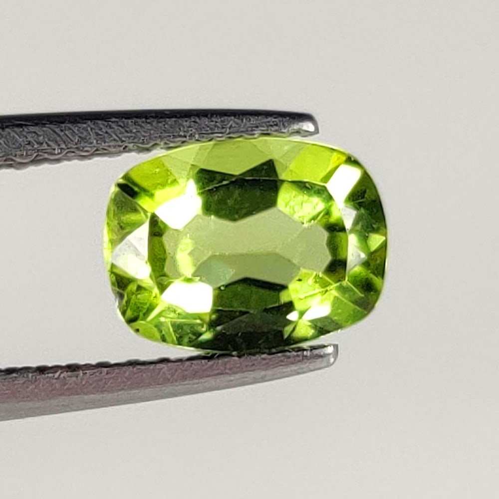 1.40 Ct Natural Green Peridot Cushion Cut: Weight - 1.40 Ct / Dimensions - 8.00 x 6.00 x 3.70 mm / Shape - Cushion Cut / Color - Green / Clarity - VVS / Origin - Pakistan / Treatment - None