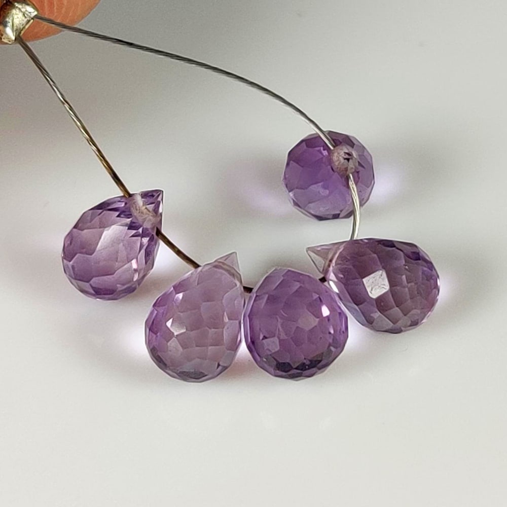 4.29 Ct Natural Purple Amethyst Pear Drop Beads: Weight - 4.29 Ct / Dimensions - 7.0x4.5 - 7.5x4.6 mm / 5 Pc's/ Shape - Fancy Pear Drop Beads / Color - Purple / Clarity - VVS / Origin - Brazil / Treatment - Heated