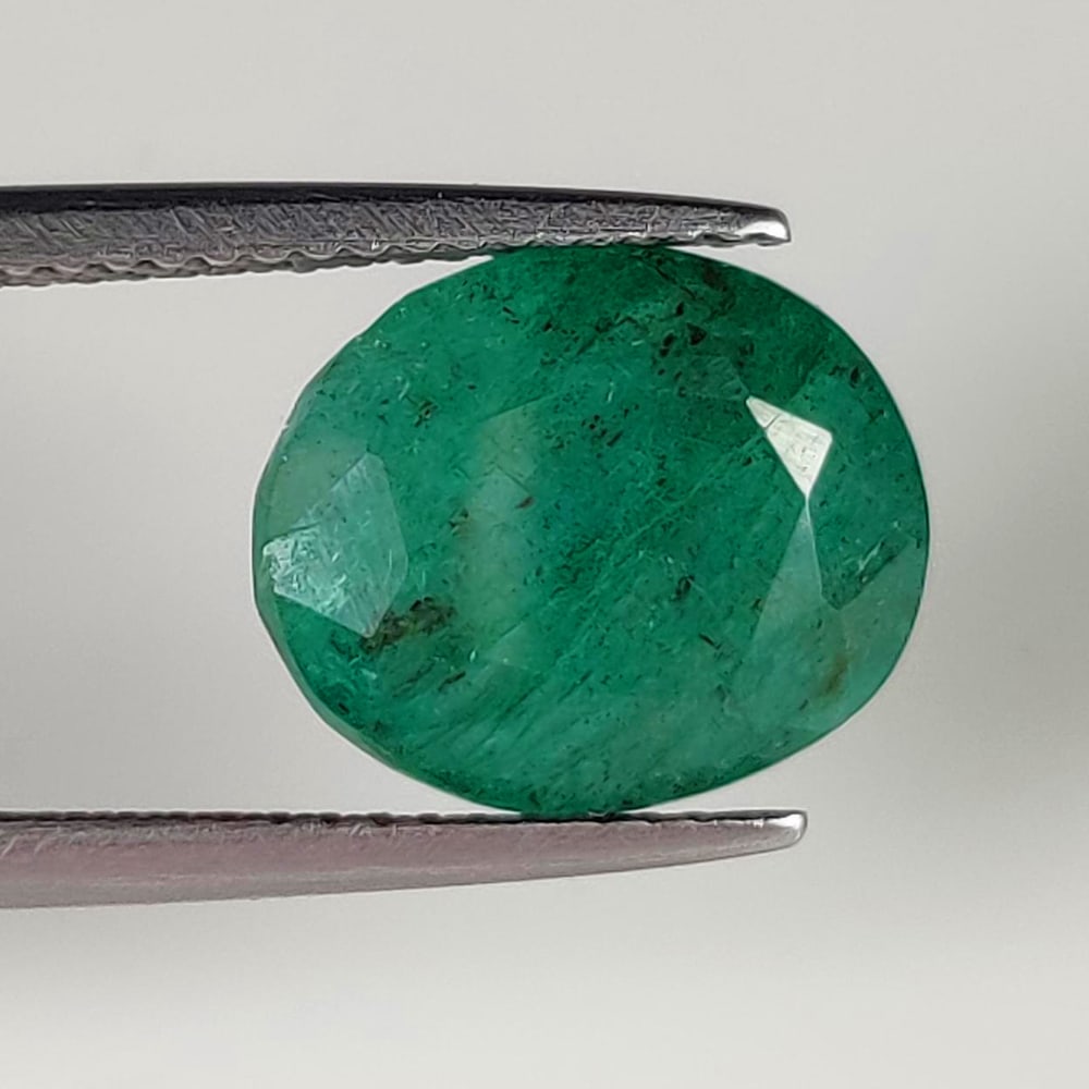 5.35 Ct Natural Green Emerald Oval Cut: Weight - 5.35 Ct / Size - 12.00 x 10.00 x 6.00 mm / Shape - Oval Cut / Color - Green / Clarity - SI / Origin - Zambia / Treatment - Color Coated