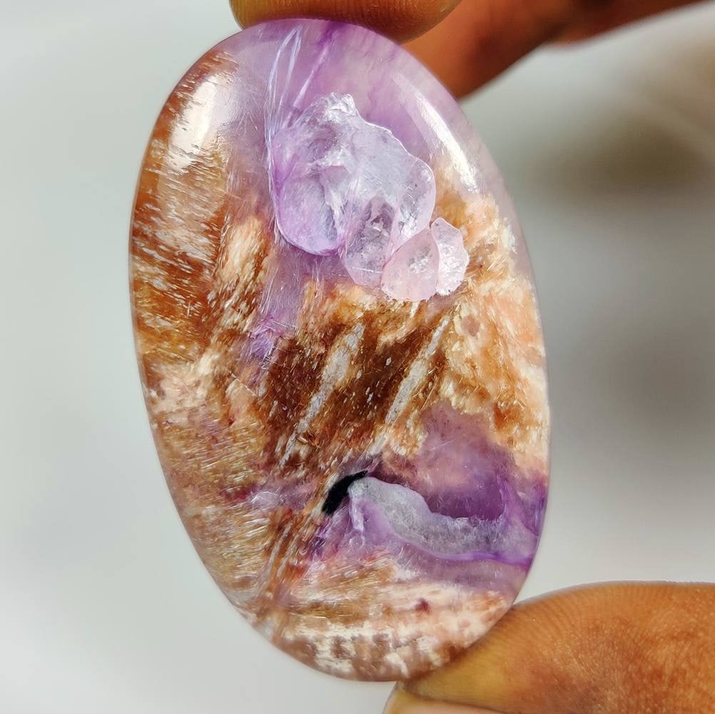 86.90 Ct Natural Russian Charoite "Bold scale" Oval Cab: Weight - 86.90 Ct / Dimensions - 51.00 x 31.00 x 7.00 mm / Shape - Oval Cab / Color - Purple / Clarity - Opaque / Origin - Russian Federation / Treatment - None