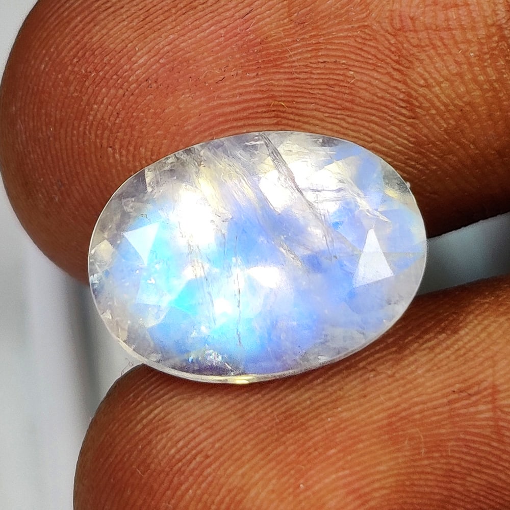 6.81 Ct Natural Blue Tint Moonstone OVal Cut: Weight - 6.81 Ct / Size - 15.00 x 11.00 x 8.00 mm / Shape - Oval Cut / Clarity - Semi-Transparent / Origin - India / Treatment - None